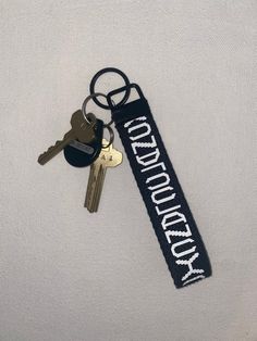 there is a keychain that has the words democracy on it and two keys attached to it