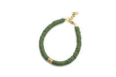 An olive green heishi bead bracelet is the perfect on-trend accessory to top off your look. It is a great stand alone bracelet and works well as a stack bracelet, too. This non-stretch bracelet features olive green polymer clay heishi beads with gold brushed metal beads in the center, all hand-strung onto flexible jewelry wire. The bracelet is finished off with a lobster clasp, and a 1" extender chain to accommodate various wrist sizes. MATERIALS Polymer Clay & Metal Beads SIZE 6 1/2" Extendable Green Heishi Bead Jewelry Bracelet, Green Heishi Beads Bracelet, Heishi Bead Bracelet, Stack Bracelet, Green Bracelet, Jewelry Wire, Heishi Beads, Brushed Metal, Bracelet Stack