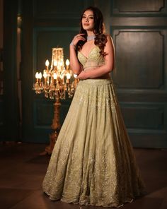 This pistachio green lehenga set features all-over sequin, crystal, cutdana, and bead embroidery. Paired with a dramatic feathered dupatta and strappy corset blouse embroidered with sequin and crystal detailing on net.DELIVERY TIMEPlease allow 8-12 weeks for your outfit to arrive.FABRIC DETAILSNetProfessional cleaning only. Anarkali Green Hand Embellished Choli, Green Hand Embellished Bollywood Sharara, Hand Embellished Green Bollywood Sharara, Pista Green Hand Embellished Festive Sets, Bollywood Style Hand Embellished Green Sharara, Hand Embellished Pista Green Festive Set, Festive Hand Embellished Pista Green Set, Festive Hand-embellished Pista Green Set, Green Hand Embellished Lehenga For Reception