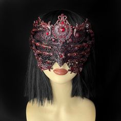 Seer Blindmask Beautiful ornate blindmask to unleash your gothic fantasy. This mask is in a brushed red effect with red rhinestones, finished with filigree flowers and two skeletal hands. Perfect for gothic brides, engagement photoshoots, evil queen cosplays, alt events, music videos and more. Other colour variations available, please DM in advance with your request.  Handmade to order. This design will take between 3-6 weeks during busy times. ------------------------------------------------ Ha Medieval Masquerade Mask For Halloween Cosplay, Adjustable Fantasy Masks And Prosthetics For Events, Gothic Mask Costume Accessories For Fantasy Events, Gothic Masks And Prosthetics For Cosplay With Adjustable Fit, Gothic Mask For Fantasy Events, Medieval Masquerade Mask For Halloween, Fantasy Style Masquerade Mask For Cosplay Events, Medieval Style Masks And Prosthetics For Masquerade Cosplay, Fantasy Eye Mask For Cosplay