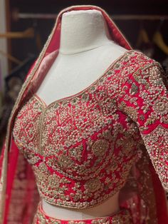 A traditional dark cerise pink flared skirt is decorated with floral motifs enhanced with gleaming sequins, cut dana, zardozi, pearl, stone and zari embroidered details radiates charm.Completed look with similarly embroidered blouse and net dupatta. Fabric: Silk Size:38/M Ready to Ship! Pink Bridal Wear, Cerise Pink, Pearl Stone, Pink Bridal, Net Dupatta, Embroidered Details, Fabric Silk, Floral Motifs, Flared Skirt