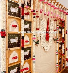 the wall is decorated with white and red garlands, horse decorations, and other items