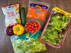 some vegetables are sitting on the table and ready to be packed into lunches or salads