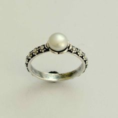 Timeless Silver Sterling Silver Pearl Ring, Timeless Sterling Silver Pearl Ring In Silver, Timeless Silver Pearl Ring In Sterling Silver, Delicate Sterling Silver Pearl Ring, Elegant White Sterling Silver Flower Ring, Classic White Flower Promise Ring, Minimalist Silver Pearl Wedding Ring, Dainty Silver Pearl Drop Ring, Dainty White Pearl Ring In Sterling Silver