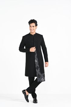 Black Panelled Achkan with embroidery detail paired with black trousers. Color of the actual garment may vary due to lighting conditions during the shoot.
 

Size Chart For Men





	
	
					Men's Size Chart
		

		
		
						
				Size Chart For Men
				Custom Size Measurement Guide
			
			
				
				
				Custom Size Measurement Guide
1. Take your measurements at ease…don’t hold your breath!
2. Be a little generous with the measurements. It’s always easier to take the garment in than to take it out Black Semi-formal Kurta For Festive Occasions, Black Traditional Wear For Festive Semi-formal Occasions, Black Semi-formal Traditional Wear For Festive Occasions, Black Long Sleeve Traditional Wear For Groom, Black Long Sleeve Sherwani For Groom, Black Kurta For Groom Eid Occasion, Black Traditional Wear For Groom, Black Traditional Wear For Groom On Eid, Black Festive Sherwani For Semi-formal Occasions