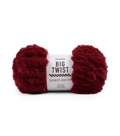 a red ball of yarn with the words, big twist written on it in white