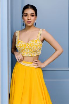 Mango yellow layered plain lehenga paired with floral motif pearl worked blouse. Comes with hand embroidered belt.
Component: 3
Embroidered
Neckline: Sweetheart
Sleeve Length: Sleeveless
Fabric: Georgette
Color: Yellow
Layered lehenga
Plunging neck - Aza Fashions Yellow Embellished Designer Wear Sets, Designer Yellow Embellished Sets, Elegant Yellow Georgette Lehenga, Elegant Yellow Lehenga In Georgette, Embellished Yellow Sets For Reception, Festive Yellow Hand Embellished Set, Festive Hand Embellished Yellow Set, Festive Yellow Hand Embellished Lehenga, Elegant Embellished Yellow Sets