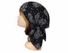 Elastic back for easy-on, easy-off style.  Perfect to wear for those with hair loss or as a fun fashion statement. Machine Wash Cold. Made in the USA. Polyester One size fits most Black Bohemian Headwrap Headband, Black Bohemian Headwrap In Headband Style, Adjustable Black Headwrap For Beach, Adjustable Black Headwrap For The Beach, Adjustable Black Bohemian Headwrap, Festival Bandana Headband One Size Fits Most, Festival Bandana Headband, One Size Fits Most, One Size Festival Bandana Headband, Festival Bandana Headband