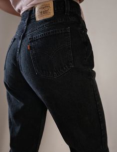 "Women's Vintage Levi's Jeans Orange Tab Black Denim SKU: OT L BLK 4 Made in Canada 100% Cotton high quality non stretch denim Waist snatching high waisted fit Curves beautifully around the hips Tapered straight leg Levi's Orange Tab ( has a similar fit to Levi's 512 ) YKK Zipper and Single Button Closure Stunning Dark Black Wash Item is in excellent Vintage condition with no significant flaws to note About the Fit: Model is 5,7\" and usually wears a modern women's size S - M, US 4 - 6, 28. The Classic Fitted Jeans For Streetwear, Fitted Washed Black Jeans With Pockets, Black Fitted Rigid Denim Bottoms, Fitted Black Rigid Denim Bottoms, Classic High Waist Washed Black Bottoms, Classic High-waist Washed Black Bottoms, Black Denim Bottoms With Standard Cut Leg, Fitted Washed Black Rigid Denim Bottoms, Fitted Rigid Denim Bottoms In Washed Black