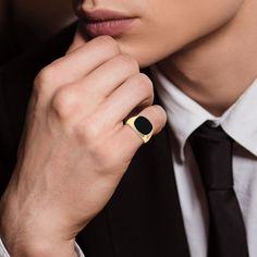 The epitome of class… A sleek gold ion-plated men's ring featuring a smooth black onyx center stone.The simple and classy design is perfect for any well-dressed gentleman.This durable stainless steel ring is the perfect statement piece; whether it's for everyday wear, or on your pinky for a special occasion.Designed for greatness, this ring will inspire you to make your own legacy. Pinky Ring Mens, Stone Rings For Men, Military Jewelry, Mens Pinky Ring, Black Stone Ring, Pearl And Diamond Necklace, Romantic Gifts For Her, Jewelry Catalog, Classy Design