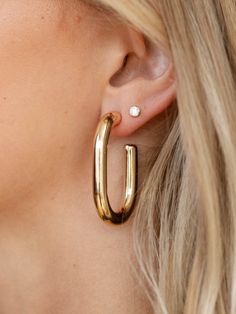 These oval style hoop earrings feature a shiny, thick silhouette to add more of a bold inspired design to the look. Trendy Oval Everyday Earrings, Trendy Oval Earrings For Everyday, Trendy Oval Hoop Earrings, Bridal Shower Outfit, Denim Hoodie, Dressy Dresses, Mother Denim, Capri Blue, Maxi Dresses Casual