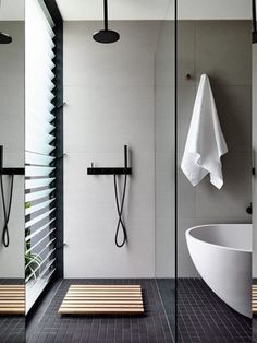 a modern bathroom with black and white accents