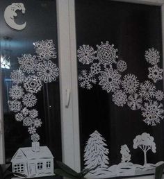 two frosted glass windows with snowflakes on them