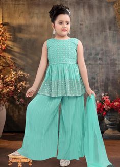 ABOUT THIS ITEM This girls Chudidhar set with duppatta is suitable for kids 3-15 yrs age. Fabric Details: This is an exclusive Bollywood style party wear featuring excellent craftsmanship, beautiful embroidery, traditional prints, and vibrant colors.  The set is made with soft fabric with lining, light weight material with lining that is skin-friendly, breathable, and comfortable to wear for kids. Age Group: 3 - 15 years. For best fitting, please take measurements for your child and refer to the size chart in the last picture before purchase. Wash care Instructions: Do not bleach, Iron at low heat, and Dry Clean ( preferred for first wash). Occasion: Birthday gift, Festive wear, party/casual wear, wedding, and all special occasions. Package Includes: 1 Kurta +1 palazzo salwar + Dupatta The Green Sets With Dori Work For Navratri, Bollywood Style Green Sharara For Summer, Green Dori Work Sets For Navratri, Festive Light Green Zari Work Set, Festive Light Green Sets With Zari Work, Green Palazzo Set For Navratri Party, Bollywood Style Green Festive Sets, Green Bollywood Sets For Eid, Green Sets With Dupatta For Summer