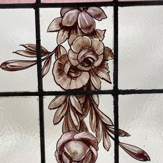 a stained glass window with flowers on it