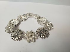 Vintage flowered bracelet silver tone bracelet antique jewelry. his is a lovely bracelet with silver & rhinestone flowered petals, unmarked. in good vintage condition. please all photos for details. thanks for looking and be sure to check out our other items! we have lots of vintage items, especially jewelry. we put new listings on daily so be sure to check back often. don't forget to add us to your favorites list! hughes-antique Favorites List, Pattern Glass, Estate Wedding, Flower Bracelet, Silver Rhinestone, Vintage Pins, Bracelet Silver, Flower Petals, Chain Link Bracelet