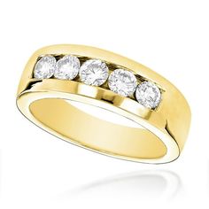 a yellow gold ring with five diamonds