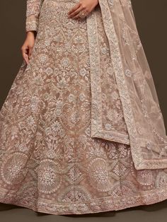 Craving to steal the show with an ethnic look by wearing this gorgeous beige soft net lehenga embellished with thread, and dori embroidery, and highlighted with glitter zari, and beautiful badla.
This gorgeous beige soft net lehenga comes with a similar color soft net blouse embellished with the same design as the lehenga and comes with a beautiful similar color dazzling dupatta embellished with thread, dori embroidery through zari, and beautified with glitter badla.
This stunning beige lehenga Beige Anarkali Gown With Traditional Drape, Bollywood Style Cream Choli With Pallu, Beige Floor-length Gown With Sheer Dupatta, Anarkali Cream Gown With Zari Work, Semi-stitched Cream Lehenga For Party, Cream Semi-stitched Gown With Pallu, Anarkali Style Cream Lehenga With Pallu, Bollywood Style Cream Saree Gown, Beige Choli With Sheer Dupatta