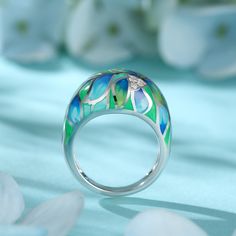 How beautiful is this sweet spring ring? The ring features flowers and leaves that wrap around your finger, detailed with bright enamel for lovers of colour! The perfect accessory for spring and summertime, or to keep the floral vibe going all year round.Carat Weight: 0.072 ctStone Size: 1.4 mmNumber of Stones: 3 Stone Shape: RoundStone Color: Diamond WhiteWeight: 4.79 gWidth: 3.7 mmHeight: 7.7 mmThickness: 1.6 mmMaterial: 925 SilverPlating Color: Silver Dreamy Garden, In Full Bloom, For Lovers, Flowers And Leaves, How Beautiful, Spring Rings, Wrap Around, Custom Design, Band