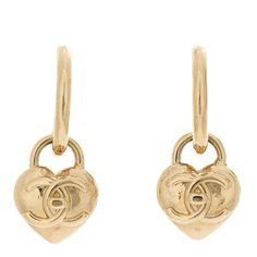 This is an authentic pair of CHANEL Metal CC Heart Turnlock Drop Earrings in Gold. These elegant earrings feature gold dangling hearts with CC logos in the center. Luxury Gold Double Heart Earrings, Luxury Gold Heart Earrings, Luxury Earrings With Heart Charm, Luxury Double Heart Earrings, Luxury Heart-shaped Drop Earrings For Anniversary, Luxury Gold-tone Earrings For Anniversary, Luxury Gold Earrings With Logo Charm, Luxury Dangle Hoop Earrings, Luxury Heart-shaped Earrings