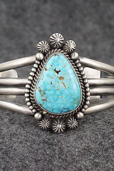 This natural Kingman turquoise and sterling silver bracelet was made by Navajo silversmith Michael Calladitto. The inside is signed MC and stamped Sterling.Size: 5 3/4" (will fit up to a 6 7/8" wrist)Gap: 1 1/8"Width: 1 3/4"Cuff Width: 5/8"Free shipping on all orders! We ship with USPS and always include tracking. All orders ship within a day of payment.Returns are accepted up to 30 days after you receive your order. Just send us a message. Our shop offers cash back or store credit. The item mus Silver Things, Camping Blanket, Kingman Turquoise, American Jewelry, Cuff Bangles, Sterling Silver Bracelet, Holiday Sales, Native American Jewelry, Turquoise Sterling Silver