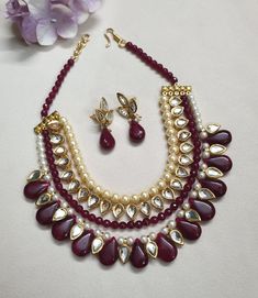 Ruby Red Kundan Necklace Set With Earrings, Indian Jewelry, Bollywood Jewelry Set, Sabyasachi Inspired Jewelry, Multi Layered Necklace * Necklace Length: 17 inches (comes with adjustable sarafa/dori/cord) * Earrings Length: 1 inch approx * Material: Brass, Kundan * Package: Necklace and Earrings STYLE TIP: The Look Is Stunning And Perfectly Suitable For All Kinds Of Dressy Occasions. Wear with an ethnic outfit for any occasion. This traditional set can complement any International attire. ABOUT Red Necklaces With Latkans For Diwali, Festive Red Necklaces With Latkans, Festive Red Necklace With Latkans, Red Round Beads Kundan Necklace For Festivals, Red Necklaces With Latkans For Puja, Red Necklace With Latkans For Puja, Red Kundan Jewelry With Round Beads, Red Kundan Necklace With Round Beads For Festivals, Handmade Red Kundan Necklace For Party