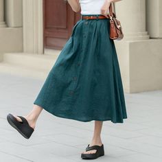 "Showcase your style in a sophisticated mid-calf A-line skirt, beautifully tailored in a lush shade of green. The skirt features a distinctive button detail that adds a unique touch. Ideal for the blooming season of spring, this skirt is a perfect addition to any plus size wardrobe.  DETAIL * 100% Linen * Two side pockets * Back elastic waist * Button front skirt * Below Knee Length * Midi skirt  * A Line skirt * Perfect for Spring, Summer and Autumn * Wash by hand or machine with cold water * Model's belt is not sale item More colors :  https://etsy.me/3PlsCmO * The model is 170 cm (5′ 7″) tall with a 80 cm (31.5\") bust, 66 cm (26\") waist. She is wearing in size XS. CUSTOM MADE SERVICE If you * Change other color * Can't find your size in our size Chart * Change the Style * Change the l Summer A-line Skirt With Button Closure, Knee-length Summer Bottoms With Buttons, Casual Maxi Skirt With Button Closure For Summer, Knee-length Summer Skirt With Button Closure, Summer Knee-length Skirt With Button Closure, Summer Wide Leg Maxi Skirt With Button Closure, Buttoned A-line Skirt, Chic Skirt With Buttoned Pockets For Spring, Summer Midi Skirt With Button Closure