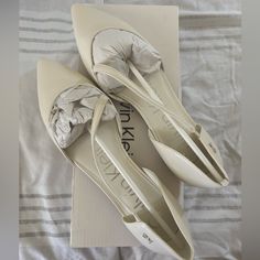 Brand New, Never Used Calvin Klein Sannie Ballet Flat Sandals. Perfect For Bridal Event Or Everyday Use! Synthetic Closed Toe Wedding Shoes For Spring, Spring Wedding Shoes, Closed Toe, Synthetic Material, Spring Wedding Shoes With Closed Toe In Synthetic Material, Spring Wedding Shoes, Synthetic Closed Toe, White Synthetic Flats With Low Heel, White Synthetic Low Heel Flats, Elegant Flat Heel Synthetic Wedding Shoes, Spring Wedding Shoes With Pointed Toe In Synthetic, Chic Synthetic Wedding Shoes With Round Toe