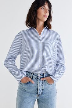 Elevate your fashion game with the pinnacle of poplin tops. Discover the unmatched quality, style, and comfort that our top-of-the-line poplin top offers. Pair it with tailored slacks or a skirt for a sophisticated office ensemble, or wear it with your favorite jeans for a chic, casual look. Two breast pockets Collared Button down Long sleeves Chic Poplin Top With Relaxed Fit, Casual Long Sleeve Poplin Top, Casual Poplin Blouse For Workwear, Relaxed Fit Poplin Top For Work, Chic Daywear Poplin Top, Chic Poplin Top For Daywear, Chic Collared Poplin Top, Casual Poplin Tops For Office, Chic Poplin Tops For Workwear