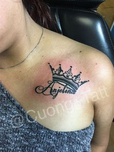 a woman with a crown tattoo on her chest