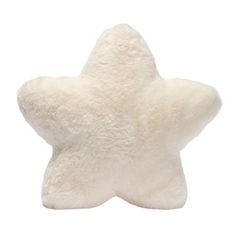 a white stuffed star on a white background