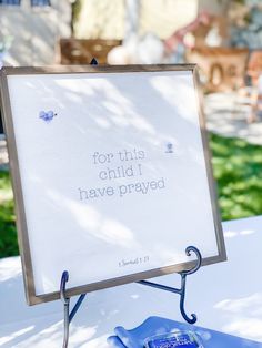 a sign that says for this child i have pray on the table in front of some chairs