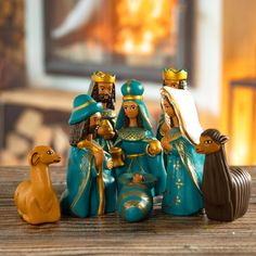 a group of figurines sitting on top of a wooden table