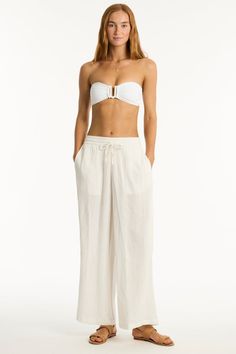 The ultimate wear-anywhere look for beachside cool and beyond. A perfect piece to layer over your favourite swim, or in mix-and-match colours for polished resort chic. Cotton cheesecloth fabric Side pockets High waisted leg pant Drawstring cord & elastic waist Fabric Composition:100% Cotton Beach Vacation Bottoms With Pockets, Relaxed Fit Beach Bottoms With Drawstring, Relaxed Fit Drawstring Bottoms For Beach, Chic Bottoms For Day Out During Resort Season, Beachwear Bottoms With Pockets, Casual Beach Bottoms With Tie Waist, Casual Tie Waist Beach Bottoms, Vacation Drawstring Bottoms For Beach, Drawstring Bottoms For Beach Vacation