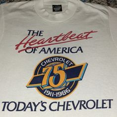 a white t - shirt with the words today's chevrolet and the heart beat of america on it