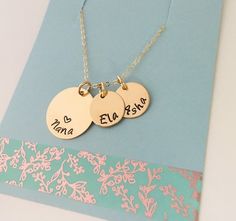 "Gold Grandma Necklace, 14k Gold Filled Grandma, Grandkids Names Necklace, Personalized Grandma Necklace Please make sure you don't forget to put the information for personalization in the note to seller box at check out :) This necklace has one 3/4\" 14k gold filled disc and up to 5 smaller name discs that measure 1/2\" that are also 14k gold filled. Necklace comes with a 18\" gold 14k filled cable chain Please provide the following at checkout in message to seller box: -Name you want stamped o Gold Charm Necklace Gift For Mom, Gold Round Disc Charm Necklace For Mom, Gold Round Disc Jewelry For Mother's Day, Gold Name Disc Jewelry, Gold Round Disc Jewelry With Name, Gold Round Disc Jewelry For Birthday, Nana Necklace, Names Necklace, Grandma Necklace