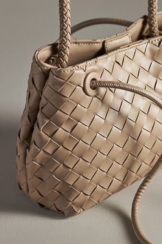 100% recycled faux leather; polyester lining One inner slip pocket One inner zip pocket Snap styling Imported | Selma Top Handle Bag by Melie Bianco in Beige, Women's, Polyester/Leather at Anthropologie Melie Bianco, Woven Design, Handle Bag, Top Handle, Color Coding, Vegan Leather, Zip Pockets, Bag Accessories, Anthropologie