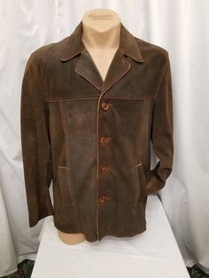 Amazing Vintage 1950s-60s DEADSTOCK Scully Men's Brown Colorblock Leather Rancher Suede Jacket Button Coat, Heavy.  Jacket has a 4 button front closure, 2 front pockets, a satin lining, accent stitching details throughout. Jacket is in amazing New vintage condition - (see pics)! Measurements when buttoned: shoulder to shoulder 20 in, chest 46 in, waist 44, sleeves shoulder to cuff 26, sleeves pit to cuff 17, neck to bottom length 31 1/2 inches. Retro Fall Pea Coat With Button Closure, Retro Long Sleeve Pea Coat With Buttons, Retro Long Sleeve Pea Coat, Brown Sport Coat With Lapel Collar And Buttons, Collared Leather Jacket With Buttons For Business, Brown Collared Blazer With Buttons, Vintage Long Sleeve Pea Coat With Button Closure, Retro Long Sleeve Outerwear With Double Button Closure, Classic Brown Pea Coat With Button Closure