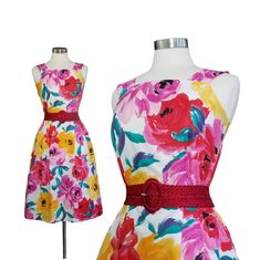 "Bold and lush summery florals on this simplistic vintage 80s sleeveless summer dress. White background and large, round florals in yellow, pink and fuchsia, make this a memorable and very photogenic dress. The fabric is a woven cotton that looks like linen on it's best behavior. Large shoulder straps and a modest squared off neckline lead to a fitted bodice. A touch of elastic as the natural waist and simple pleats, front and back lend for a slightly flared midi skirt that hits below the knees Retro Sleeveless Dress With Floral Print For Spring, Vintage Sleeveless Floral Dress For Spring, Dress White Background, Midi Summer Dress, Sleeveless Party Dress, 1960s Style, Midi Flare Skirt, Vintage Floral Dress, Sleeveless Dress Summer