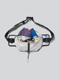 a fanny bag filled with money and other personal items in it's back pocket