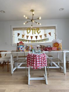 the dining room table is set for a birthday party