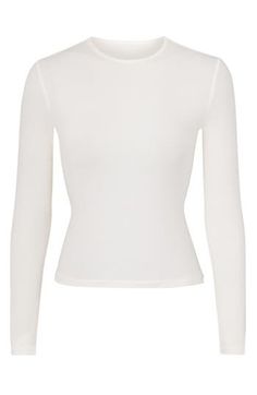 Specially washed for a vintage appearance, this long-sleeve top from Kim Kardashian's SKIMS hugs your figure and goes with endless casual looks. 17" length (size Medium) High crewneck Long sleeves 92% cotton, 8% spandex Machine wash, line dry Imported White Long Sleeve Top With Thumbholes For Spring, Fitted Long Sleeve Cotton Crop Top, Fitted Cotton Long Sleeve Crop Top, Basic Long Sleeve Crop Top, Stretch Cotton Long Sleeve Crop Top, High Stretch White Crop Top For Fall, Stretch Cotton Crop Top For Fall, White Fitted Cotton Long Sleeve Top, Fitted White Cotton Long Sleeve Top