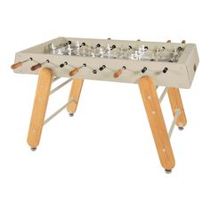 a wooden foosball table with four legs