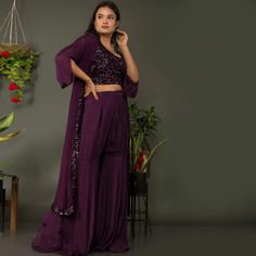 🌟Introducing TARZ's Indowestern Crop Top Sharara Pants with Jacket Set!🌟 💃Elevate your style and make a statement at any event with this exquisite indowestern ensemble from TarzIndianLehenga. Crafted from the finest georgette fabric, this outfit is designed to make you stand out in the crowd and leave a lasting impression.💃 🌠Imagine a starlit night, the sky adorned with twinkling sequins and the gentle rustle of georgette fabric as you glide across the room. This enchanting scene comes to life with our indowestern crop top sharara pants and jacket set, creating a magical experience that's sure to captivate all who witness it.🌠 👗OUTFIT DETAILS👗 ✨FABRIC: Georgette ✨INNER BLOUSE: Round neck with sequins work ✨JACKET: Long jacket with 3/4th sleeves ✨BOTTOM STYLE: Sharara pants ✨BOTTOM Semi-stitched Party Sets For Diwali, Party Wear Semi-stitched Sharara With Sequins, Semi-stitched Floor-length Sharara For Eid, Festive Floor-length Sequined Sharara, Designer Floor-length Georgette Palazzo Set, Bollywood Style Pant Set With Sheer Dupatta For Eid, Georgette Palazzo Set With Sheer Dupatta, Fitted Sharara With Unstitched Blouse For Eid, Maxi Length Georgette Palazzo Set With Sheer Dupatta