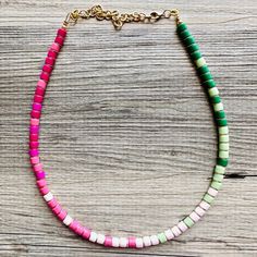 "Simply Gorgeous!! Colorful beaded necklace in rainbow colors. These acrylic beads are spaced with 18K gold donut beads.  16\" Necklace with a 4\" extender chain.  Thank you for supporting American small and handmade business. I can custom make this in any colors, any patterns, any length. Want 10 strands of red beads with silver accents instead of gold? I can make it happen! Convo me with any requests and let's bring your idea to life 💡  Like this style but prefer a different color palette? Click here: https://www.etsy.com/shop/PolkaDotDrawer?ref=mini_mfts_name&listing_id=1334686400&search_query=18K+Gold+Block+Layering Check out our other items: Www.PolkaDotDrawer.Etsy.com" Gold Donuts, Bean Necklace, Colorful Beaded Necklace, 16 Necklace, Jewelry Chunky, Chunky Statement Necklace, Necklace Colorful, Red Beads, Jelly Bean