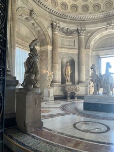 an ornate room with statues in it