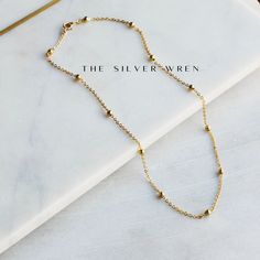 This dainty gold chain necklace, perfect for layering or a minimalist look. •18kt gold plated -lead, nickel & cadmium free•Heavy plating, tarnish resistant, water friendly Everyday 14k Gold-filled Necklaces With Tiny Beads, Dainty Hypoallergenic Gold Plated Charm Necklaces, Everyday 14k Gold Filled Tiny Beads Necklace, Everyday 14k Gold-filled Necklace With Tiny Beads, Dainty Hypoallergenic Gold Plated Charm Necklace, Everyday 14k Gold Filled Necklace With Tiny Beads, Minimalist Tiny Beads Chain Necklace For Everyday, Minimalist 14k Gold Filled Round Bead Necklaces, Everyday 14k Gold Filled Beaded Chain Necklace