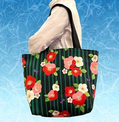 Japanese Camellia flower tote bag, This roomy bag is smart and remarkably spacious, making it a true go-anywhere, carry-everything bag. This durable shoulder bag is  soft, comfortable to carry your daily .... Ideal this purse for any situation.  [ Material] Fabric is Gorgeous and lovely Japanese Camellia flower print.  100% Cotton Brand: Kokka (Made in Japan)  Full lined with black cotton canvas. Approx Dimensions :  [Shoulder Bag] Width: 18 inches(46cm)  Height:12.5 inches(31.5cm)  Deep at the bottom: 6 inches (15cm) Strap :  Strap width 1.5" (3.5cm) Strap drop length: 12" (30.5cm) We have other bags and purses in this shop, you can find them here:  https://www.etsy.com/shop/SewEasyNewYork?ref=seller-platform-mcnav&section_id=19618681 This bag is Made to order item. Each Bag is made from Reversible Bags For Daily Use In Spring, Spring Reversible Bags For Daily Use, Spring Rectangular Reversible Bag, Spring Reversible Rectangular Bag, Japanese Camellia, Flower Tote, Large Purse, Camellia Flower, Floral Bags