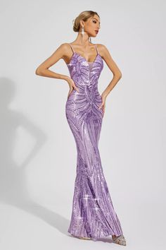 The Karter Purple Mermaid Sequins Slip Dress exudes elegance and charm, perfect for any special occasion. This floor-length dress features a slimming silhouette and delicate spaghetti straps. Adorned with mesmerizing sequins and mermaid skirt, it adds a touch of glamour and sophistication. Embrace your inner enchantress with this stunning and unique evening gown.  Length: Approx 155cm Materials: Polyester Gentle Dry Clean Only  The model is 5 ft 7 and wears size S  Color may vary due to lighting Svecane Haljine, Black Feather Dress, Pink Bandage Dress, Dream Prom Dress, Mermaid Core, As You Like It, Anne Rice, Purple Maxi Dress, Rice Ball