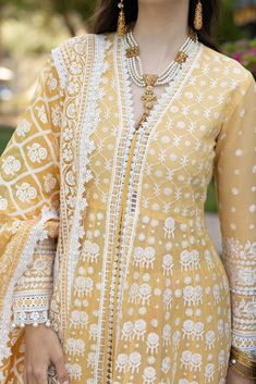 Designer Lemon Colored Frock for Pakistani Eid Dress will start shining in our secret designer attire for the evening eid event. Presenting lavish long frock and trousers that are wonderfully ornamented with embroidered base and embroidery that includes thread work just to boost up your inner happiness. Its lustrous, lush, and lavish in every sense of the word with its dazzling oyster pink frilled as well. Frock: Traditional Pakistani eid dress comes in a long frock with embellished neckline and Sobia Nazir, Pakistani Boutique, Eid Dress, Pakistani Designer Clothes, Asian Designers, Pakistani Salwar Kameez, Eid Dresses, Embroidered Sleeves, Long Frocks